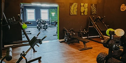 FitnessStudio Suche - kostenfreie Duschen - Plate-Loaded. - TheosGym Ribnitz-Damgarten